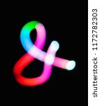 Small photo of Glowing ampersand symbol & logogram on dark background. Abstract night light painting. Creative artistic colorful bokeh. New Year. Use to build you own design for book cover, CD poster or post card