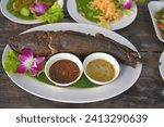 Small photo of snakehead fish ground cover chaff rice straw fire Grilled Snakehead Fish with Spicy Fresh Herbs Salad