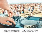 Small photo of Detail of dj playing modern sound on cd usb player at spring break festival - Beach music party and life style concept - Defocused background with shallow depth of field - Bright vivid filter