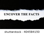 Uncover the facts concept phrase under torn paper