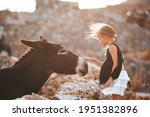 Little Girl With Donkey On The...