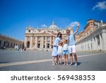 Happy family at St. Peter's Basilica church in Vatican city. Travel parents and kids on european vacation in Italy.