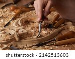 Small photo of Carpenter wood carving equipment. Woodworking, craftsmanship and handwork concept. Wood processing. Joinery work Wood carving Chisels for carving on the woodworker desk Timber Joinery work.