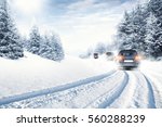 fast car on winter road and snow splash 