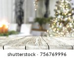 a nice Christmas tree with a green tree and a wooden table ideal for advertising or text