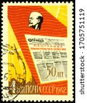 Small photo of Moscow, Russia - April 16, 2020: A stamp printed in USSR (Russia), shows portrait of Lenin and front page of newspaper Pravda, circa 1962