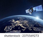 Small photo of Telecommunication satellite providing global internet network and high speed data communication above Europe. Satellite in space, low Earth orbit. Worldwide communication technology.