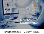 Concept of digital marketing media (website ad, email, social network, SEO, video, mobile app) with icon, and team analyzing return on investment (ROI) and Pay Per Click (PPC) dashboard in background