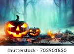 Pumpkins Burning In Forest At...