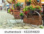 Stone paved old street with cafe bar and old bicycle in Rovinj medieval town,Croatia,Istria region,Europe