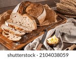 Freshly artisan baked wheat and rye bread, country bread. Simple bread  with butter for breackfast