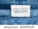 Small photo of Care instuctions label says bamboo collection on blue textile background