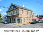 Small photo of NEW ORLEANS, LA, USA - JULY 25, 2023: Historic apartment building, formerly Beach Ball Benny's and Munster's Bar and Dance Hall, at the corner of Lyons Street and Laurel Street