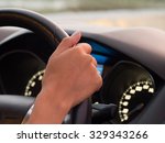 One hand driving car showing meters