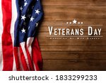 Top view overhead America United States flag, memorial remembrance and thank you of hero, studio shot with copy space on wooden table background, USA holiday Veterans or Independence day concept
