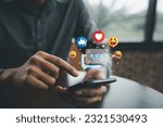 Businessman holding smartphone for social media marketing and online advertising. Digital concept of data transfer and communication. Social Distancing and Working From Home