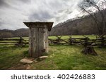 Wooden Outhouse In The Smoky...