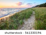 A Walk On The Beach. Sandy path winds along the shore of Lake Michigan with a sunset horizon and sand dunes as a backdrop. Muskegon, Michigan