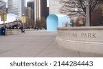 Small photo of CHICAGO, ILLINOIS, UNITED STATES - DEC 11, 2015: Millennium Park is a public park in Chicago originally scheduled to open at its namesake millennium. The Cloudgate sculpture can be seen in the