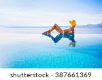 Young woman enjoying a sun at pool side. Enjoy life, vacations, holidays, sunbathing, travel, relaxation, self care, resting, leisure, recreation, healthy active lifestyle, summer fun concept