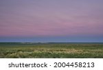 dusk over green windy prairie - Pawnee National Grassland in Colorado, early summer scenery