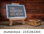 Small photo of turn knowledge into action - motivational advice on a vintage slate blackboard in a retro classroom