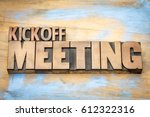 Small photo of Kickoff meeting word abstract in letterpress wood type printing blocks against grunge wooden surface