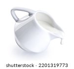  Ceramic milk jar, pot, jug isolated on white background. Milk flowing from a jug. With clipping path.