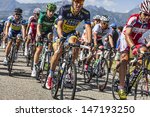 Small photo of LA ROCHETTE, FRANCE- JUL 16: The peloton pedaling on a plain road after the ascension to Col de Manse in The Alps during the stage 16 of 100 edition of Le Tour de France on July 16 2013 in La Rochette
