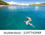 Two people snorkel off the island of Hon Mun near Nha Trang in Vietnam