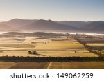 A View Across A Valley In The...