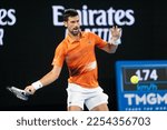 Small photo of MELBOURNE, AUSTRALIA - JANUARY 13: Novak Djokovic of Serbia hits a shot to Nick Kyrgios of Australia in an Arena Showdown charity match ahead of the 2023 Australian Open at Melbourne Park