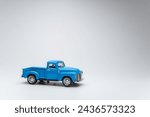 Blue toy car pickup on white...