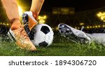 Small photo of Two football player man in action on dark arena background. Soccer player making sliding tackle