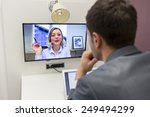 Businessman on video conference with her colleague in office job