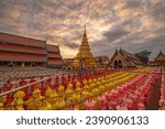 Small photo of Hundred thousand lantern festival in Lamphun is part of the Loi Krathong Festival or Yi Peng Festival To be offered as a Buddhist worship of Phra That Hariphun in lamphun, Thailand.