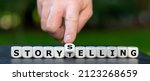 Small photo of Dice form the expressions "storytelling" and "story selling".