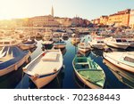 Sunset at medieval town of Rovinj, colorful with houses and church,harbor in Croatia