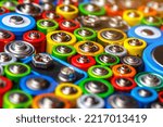 Small photo of Energy abstract background of colorful batteries.Old used batteries ready for recycling.Used batteries from different manufacturers, waste, collection and recycling,Alkaline battery aa size.