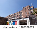 Small photo of PECKHAM, UK - MAY 19, 2018: View of the sign outside the Social bar in South London. The Bussey Building can be seen in the background.