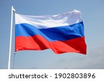 Russia flag is waving in front...