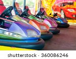 Colorful electric bumper car in autodrom in the fairground attractions at amusement park. Selective focus on the cars