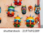 Small photo of quito, ecuador. 2nd september, 2022: colorful ama huma masks are displayed at market stall