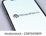 Small photo of WordPress logo mobile app on a screen smartphone iPhone macro. WordPress - open source site content management system. Batumi, Georgia - October 11, 2023