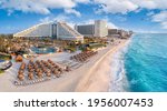 Cancun beach with resorts near blue ocean
