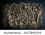 bronze keys on black background ... | Shutterstock . vector #1617840199