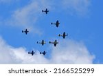 Small photo of ST NEOTS, CAMBRIDGESHIRE, ENGLAND - JUNE 11, 2022: Eight Aircraft fly past including WW2 Spitfire, Hurricane and Mustang planes