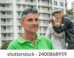 A happy man in front of Unconditional Surrender Statue in Sarasota, Florida.