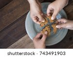 sharing concept - family sharing cookies
