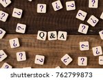 Questions and Answers Q&A concept. Q&A and question mark on alphabet tiles on wooden background